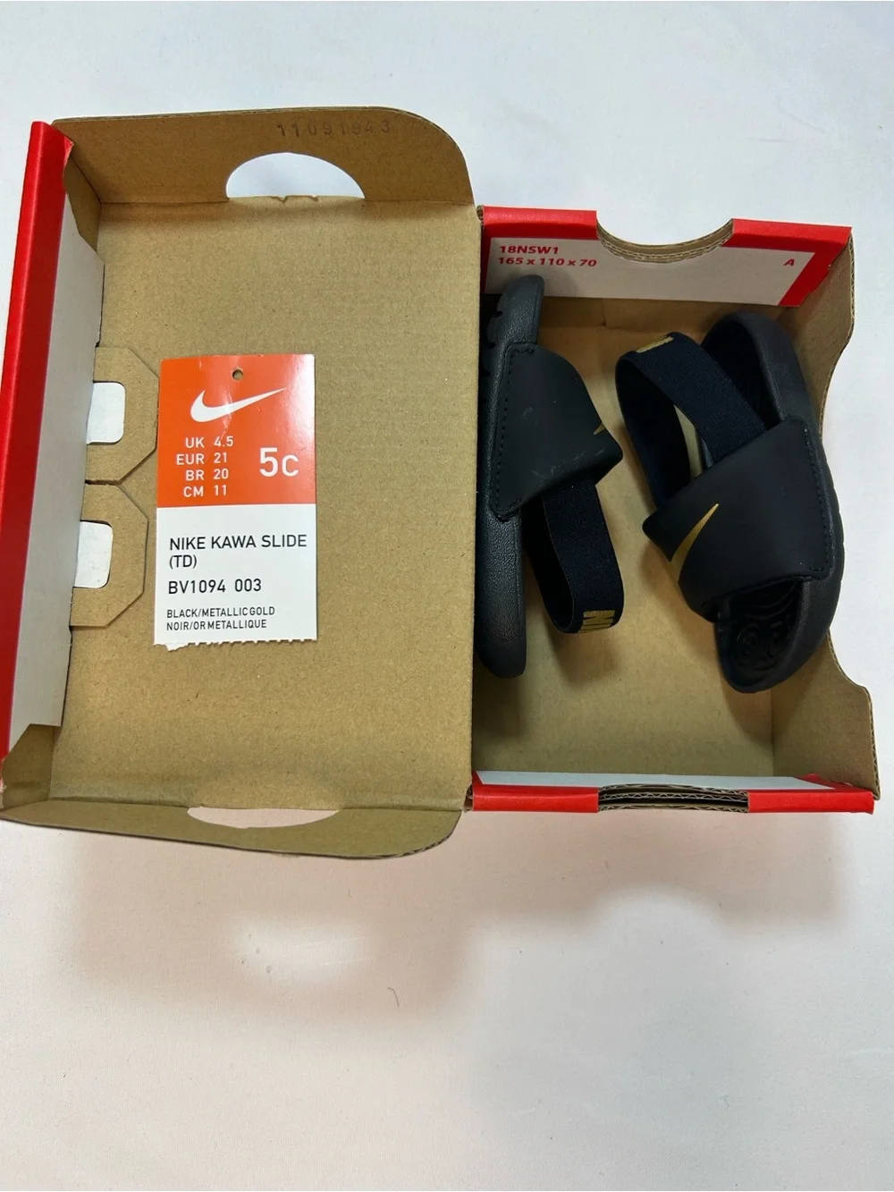 Nike Kids Black Slides with Gold Swoosh and Elastic Heel